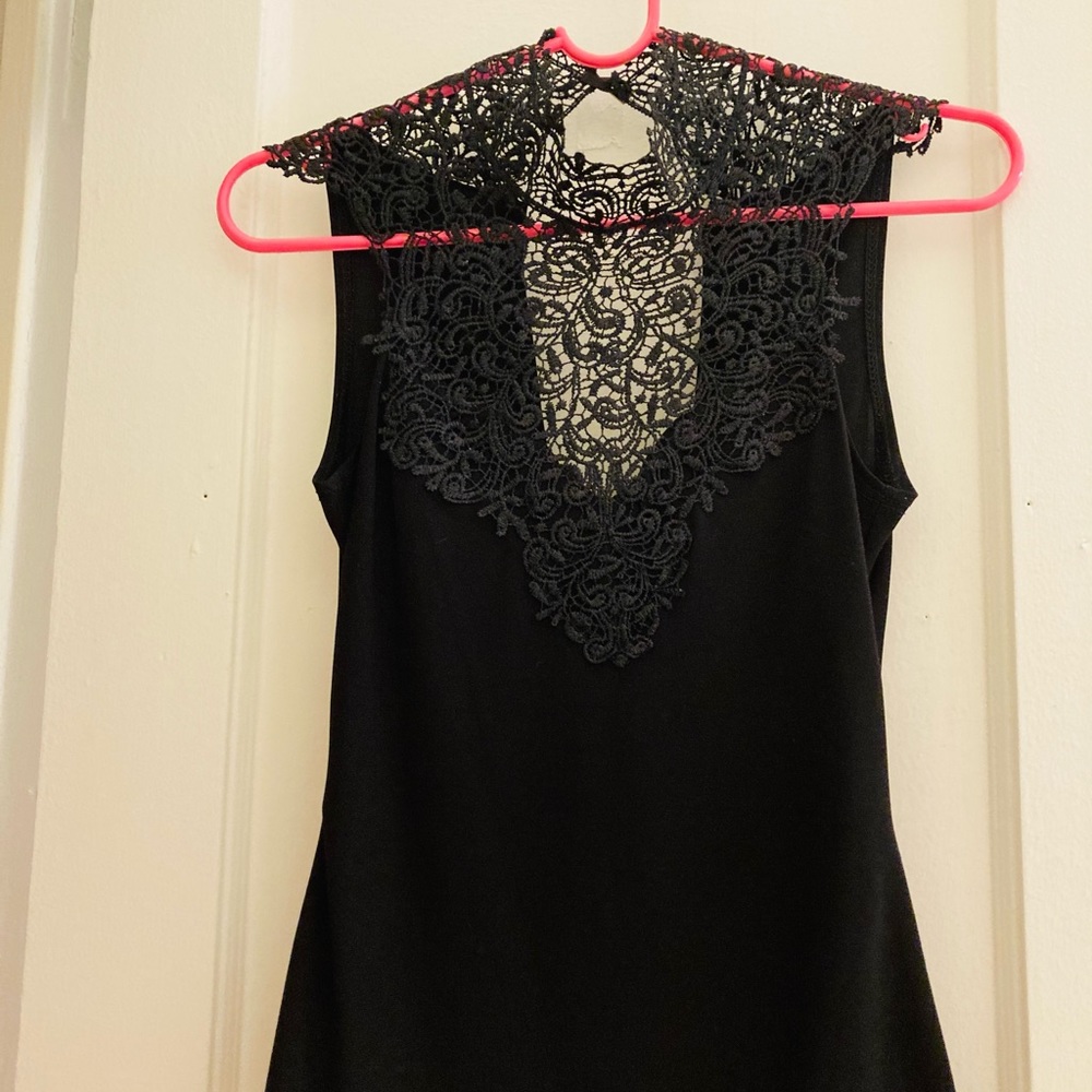 Cute blouse with detailed neckline, gold clasp